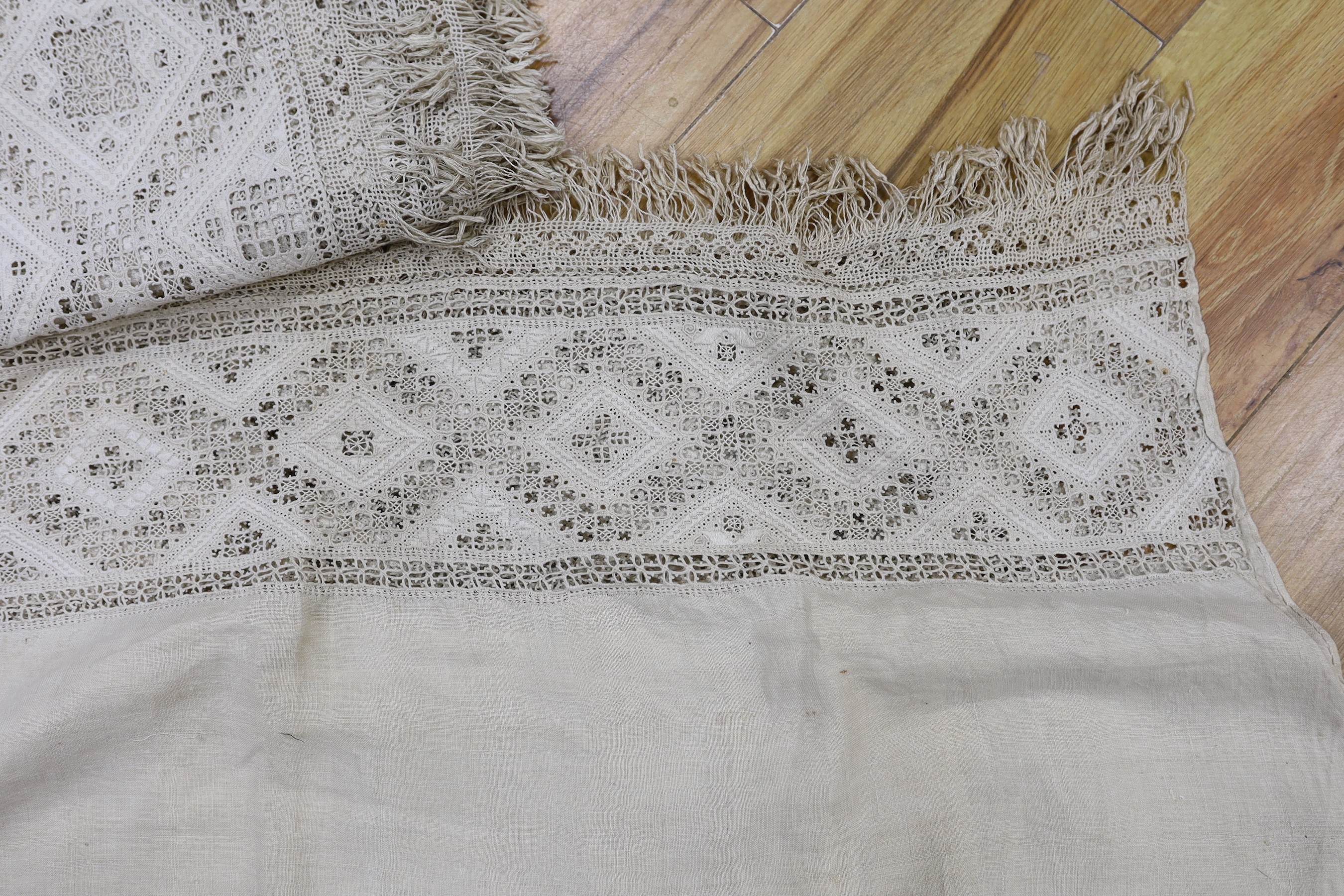 A pair of 19th century Greek hand worked and embroidered linen pelmets, 440cms long (each)